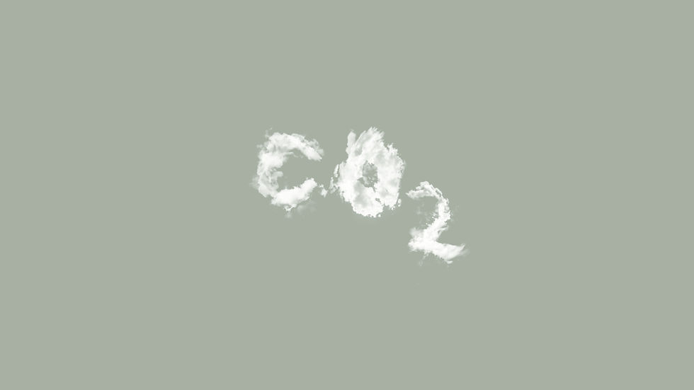 A cloud formation spells out CO2 in an otherwise clear sky. Image Credit: Unsplash/Mattias Hyde