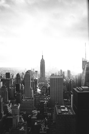 Black and white skyline of New York City featuring the Empire State Building.