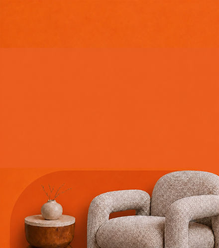 Interior scene featuring a sculptural chair, side table and vase in a warm orange-toned room.