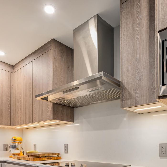 Close-up of the modern taupe kitchen with clean lines and warm tones in Ossining, NY.