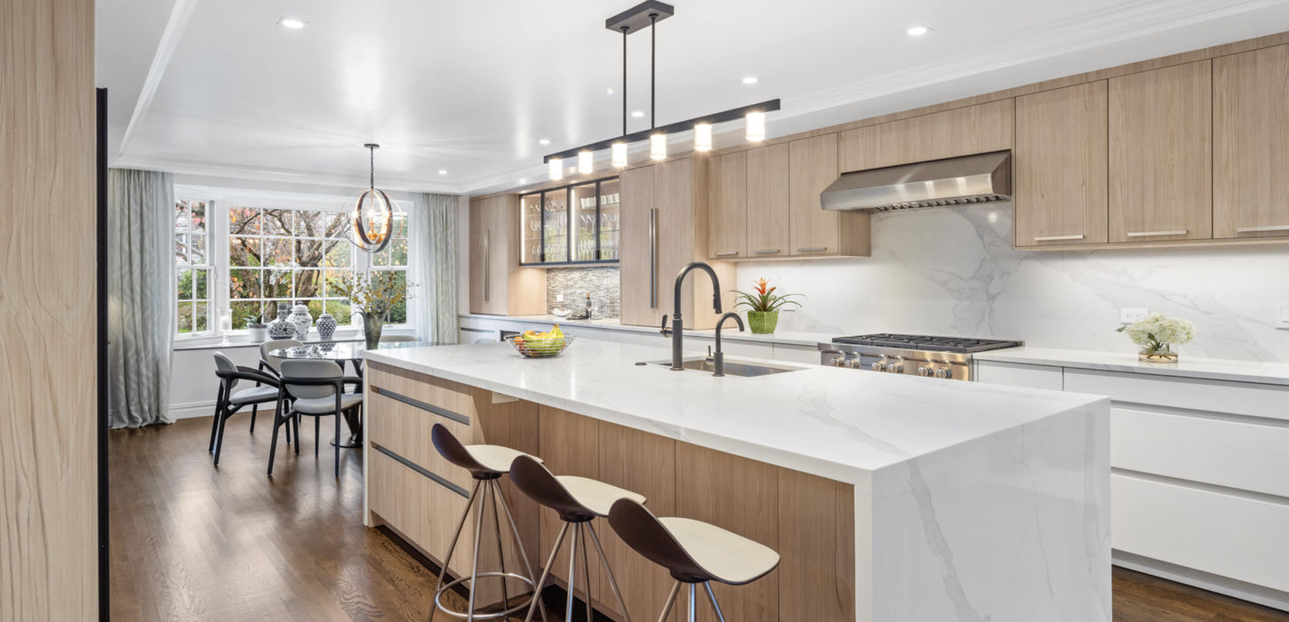 Sophisticated modern spacious kitchen with ample storage and minimalist design.