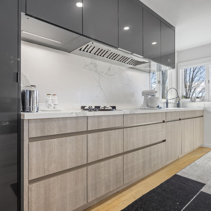 Modern grey beige kitchen with sleek cabinetry and warm neutral tones
