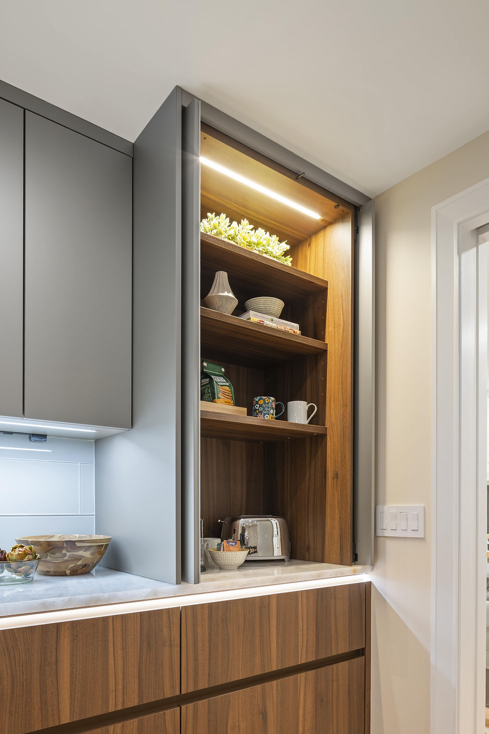 Luxury modern kitchen cabinet design showcasing storage and LED lighting.