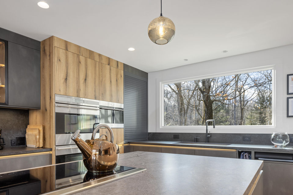Elegant Chappaqua kitchen remodel with marble countertops and oak finishes
