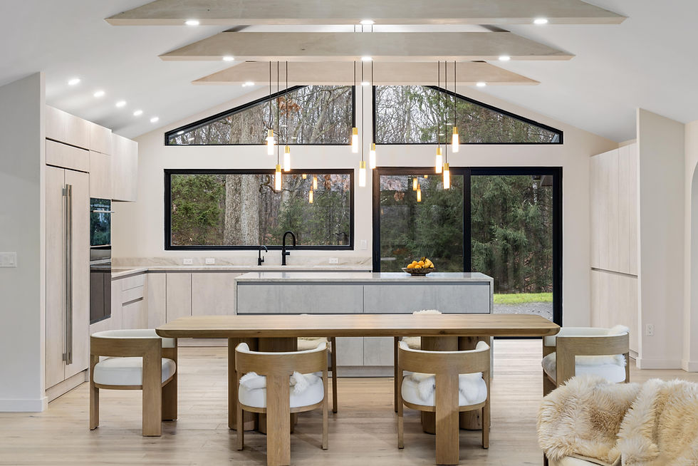 Large open space kitchen cabinetry with natural light.