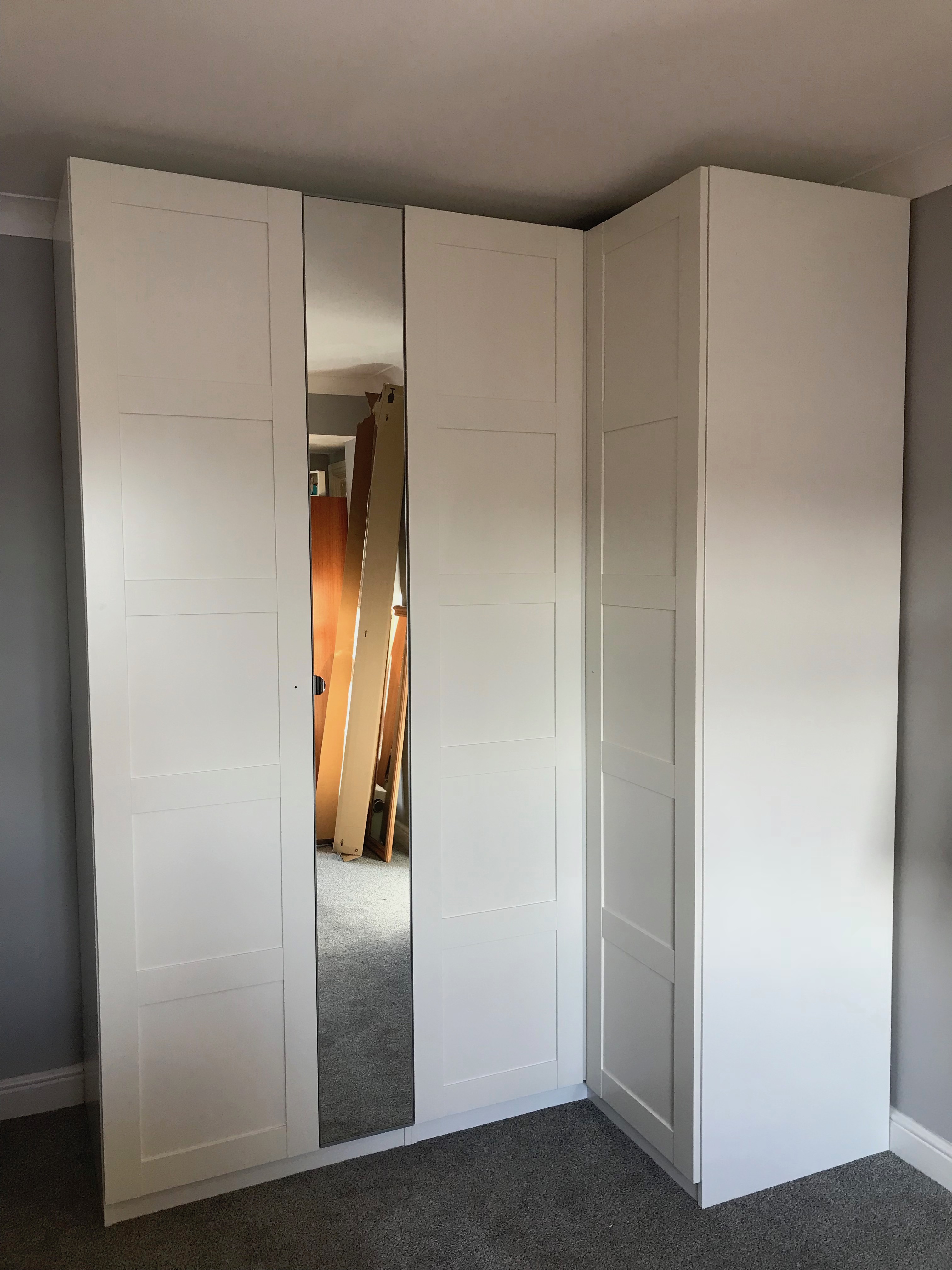 Corner Ikea PAX hinged wardrobe assembled by www.norwichflatpack.co.uk