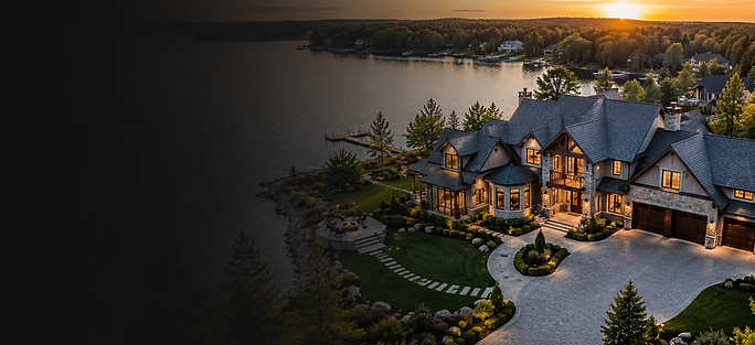 Luxury waterfront estate photographed at sunset using aerial drone photography showing shoreline access, landscaping, and premium architecture.