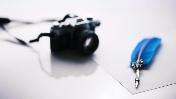 quill pen and camera on white background_edited.jpg