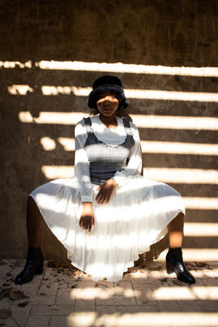 Dancer in Flowing Dress Surrounded by Trees