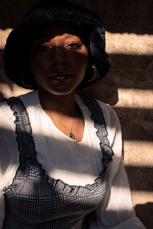 Model in Black Boots with Sunlight Lines