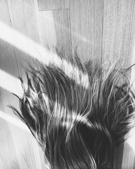 black and white self portrait featuring hair