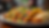 Eye-level view of a colorful Latin food platter with tacos and empanadas