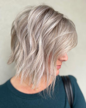 angled bob, a line haircut, icy blonde highlights, high impact blending, platinum blonde, sassy cut