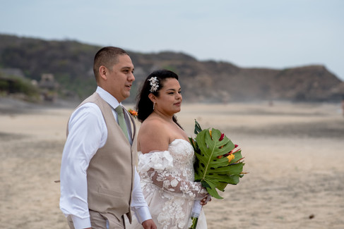 Bride and groom posing on the beach during their destination wedding in Mazunte Oaxaca