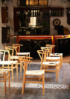 Wooden ceremony chairs arranged for an intimate wedding celebration in Oaxaca
