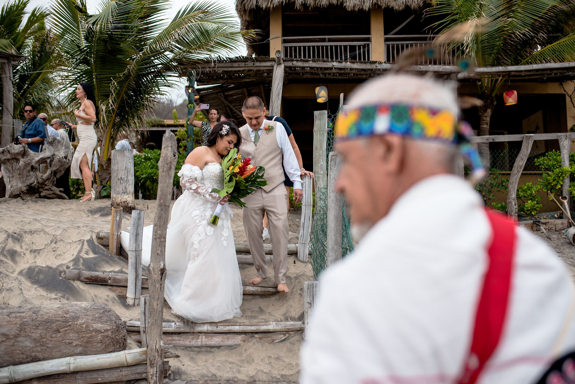 Group gathered for a spiritual beach wedding ceremony in Mazunte Oaxaca with traditional elements