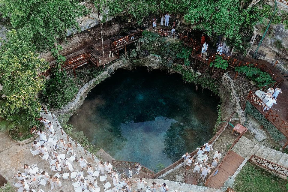 Top view of a circular cenote surrounded by lush jungle in Quintana Roo, ideal for destination weddings