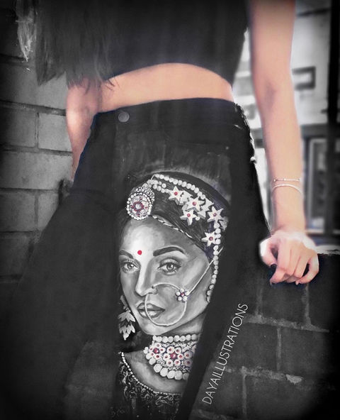 Black denim jeans hand-painted with a portrait of Aishwarya Rai as Jodha
