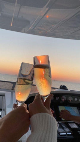 Glass of bubbly with a sunset view _.jpg
