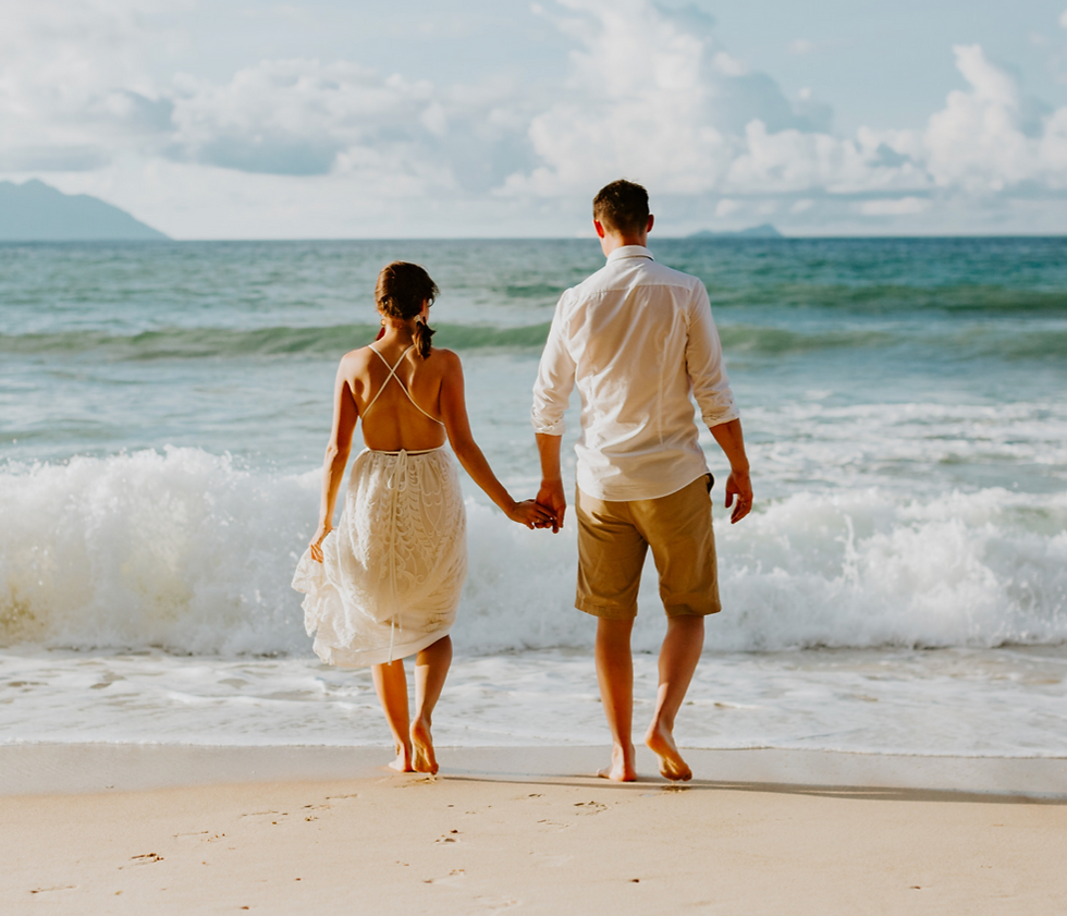 Couple Walking On Beach