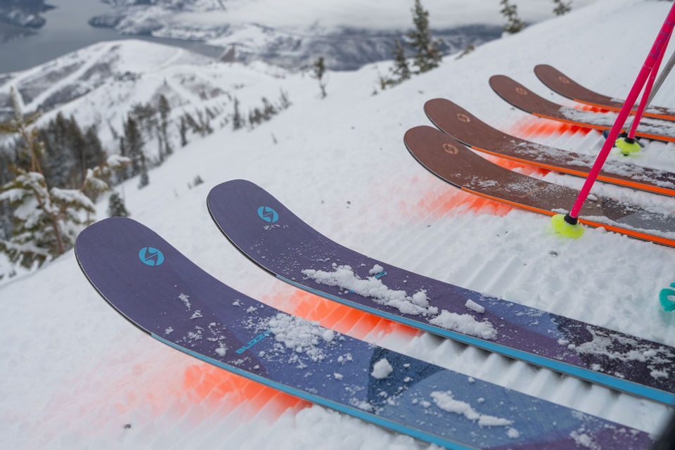 Image of three sets of Blizzard skis ready to dive into a ski run