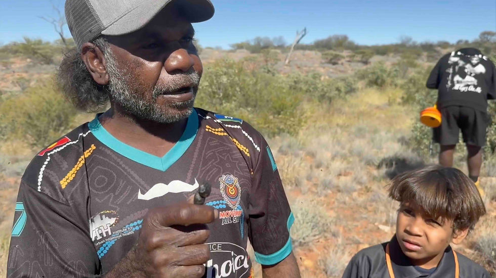 Kevin teaching students how to identify the native and feral animals by their droppings.