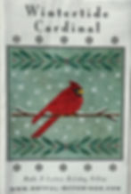 Front cover of “Wintertide Cardinal” showing a red cardinal stitched on pale green fabric with winter accents.
