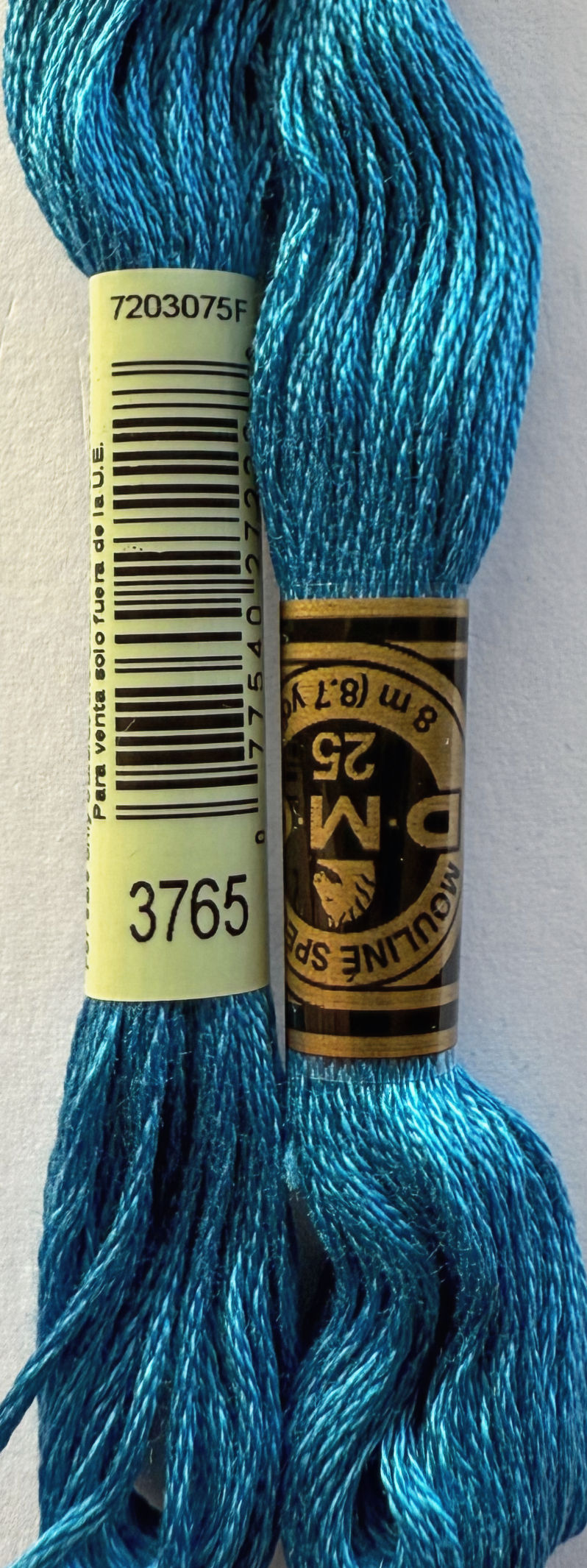 Two DMC embroidery floss spools with numbers 3765 and 25 details Bloomfield Craft