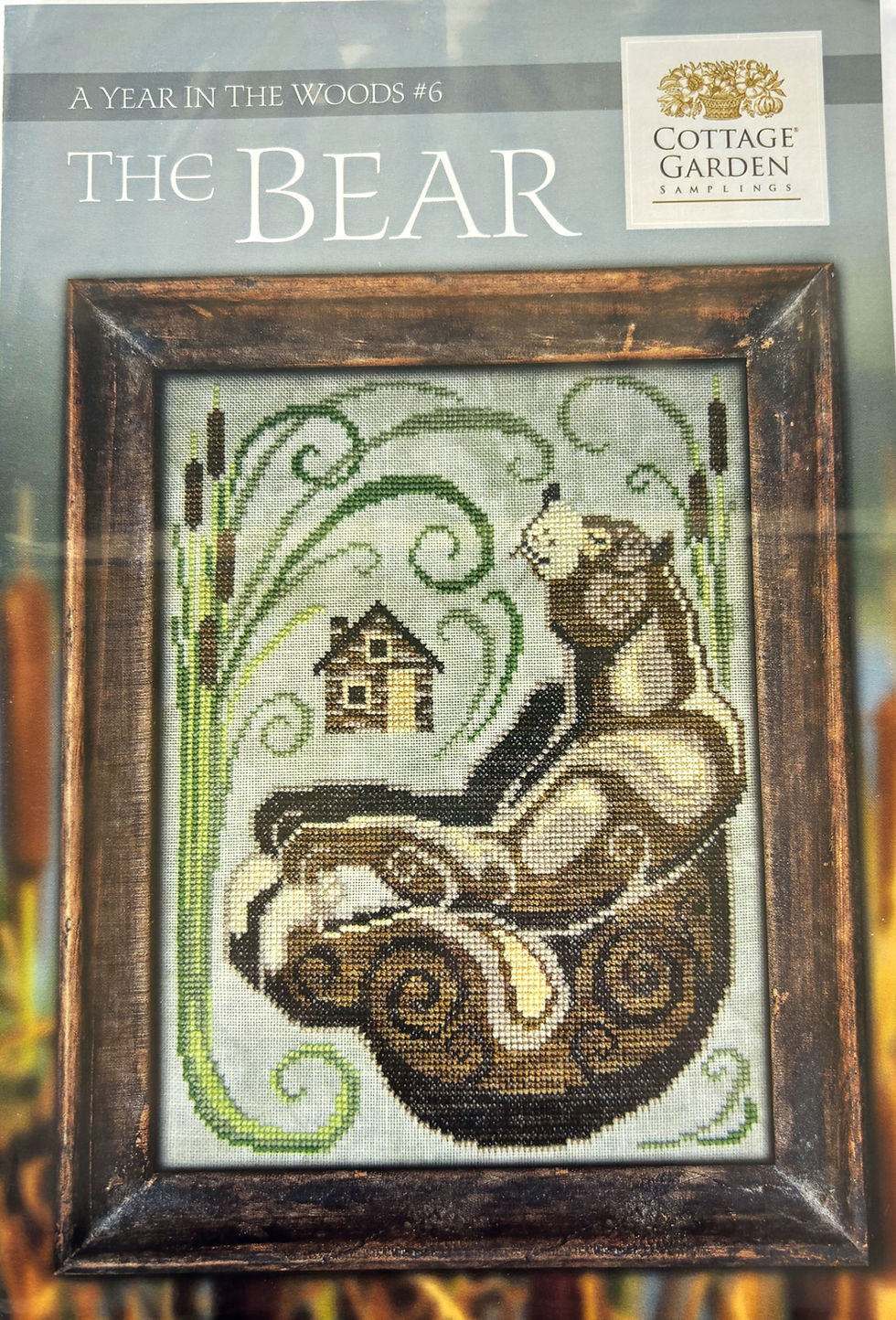 A Year in the Woods 6: The Bear, cross-stitch with bear and text Cottage Garden.