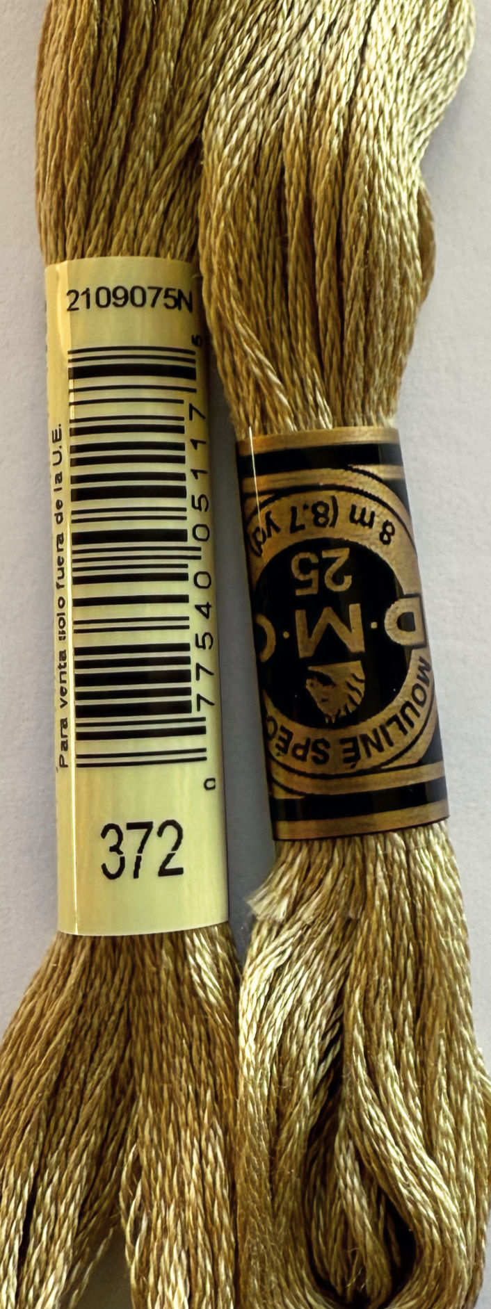 DMC 25 8 m (8.7 yds) thread spool in color 372, Bloomfield Craft.