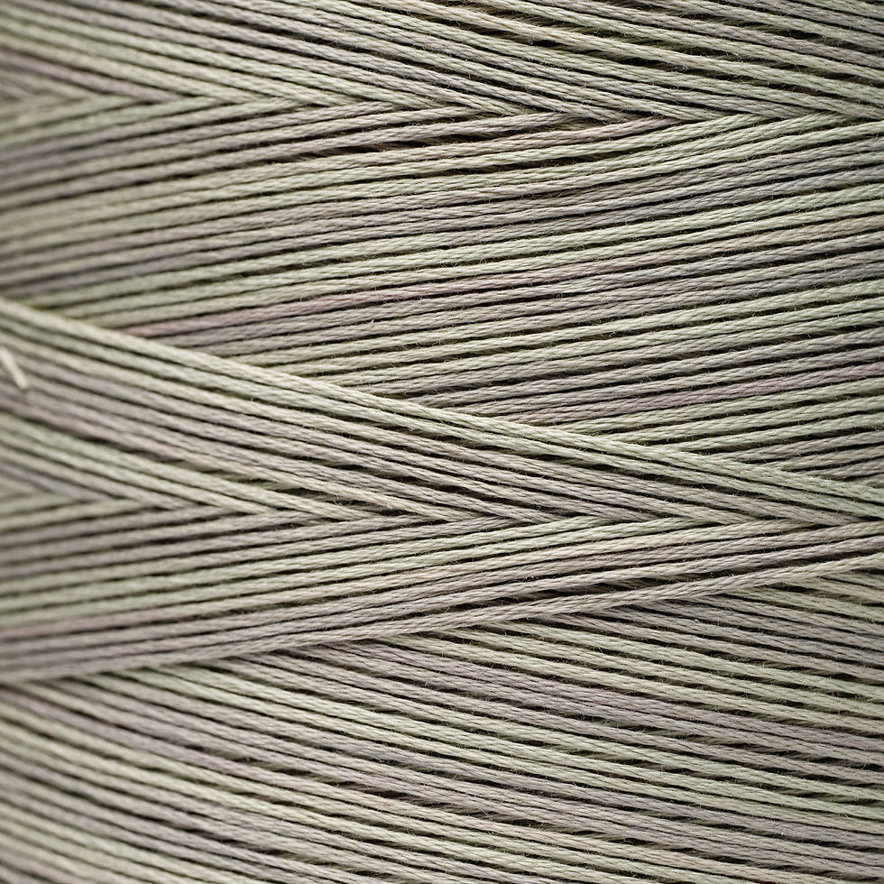 Close-up of a spool of gray twine, perfect for Bloomfield Craft projects.