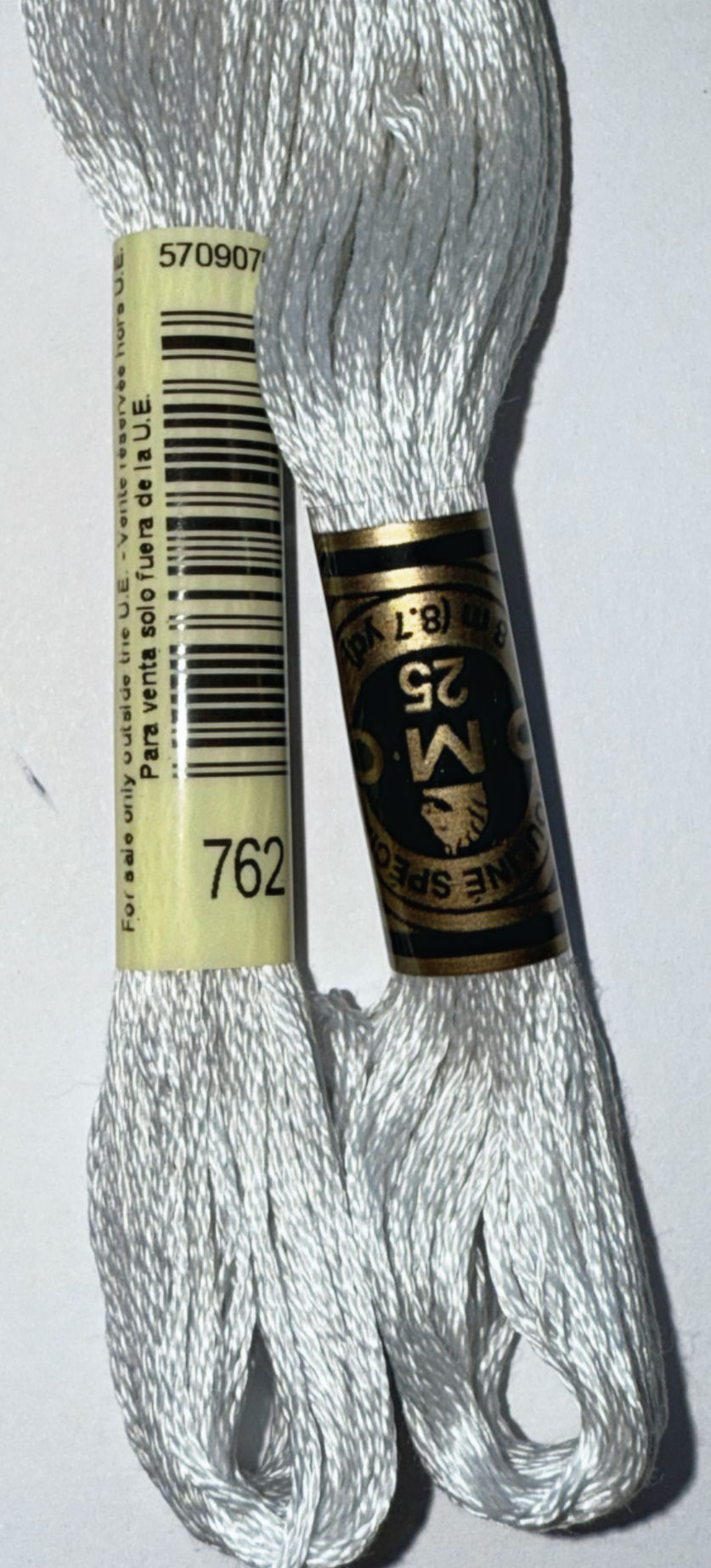 DMC embroidery floss, 762 and 25 with DMC Floss Color 828 Ultra Very Very Light Blue.