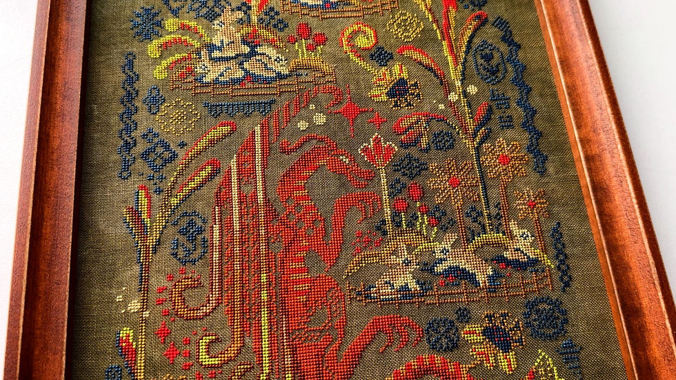 Thumbnail: Eleven Rabbits cross stitch detail with dragon and floral motifs