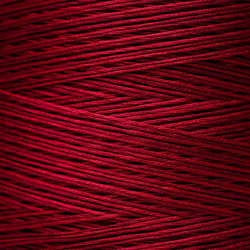 Close-up of tightly wound, textured, and rich red thread, Bloomfield Craft.