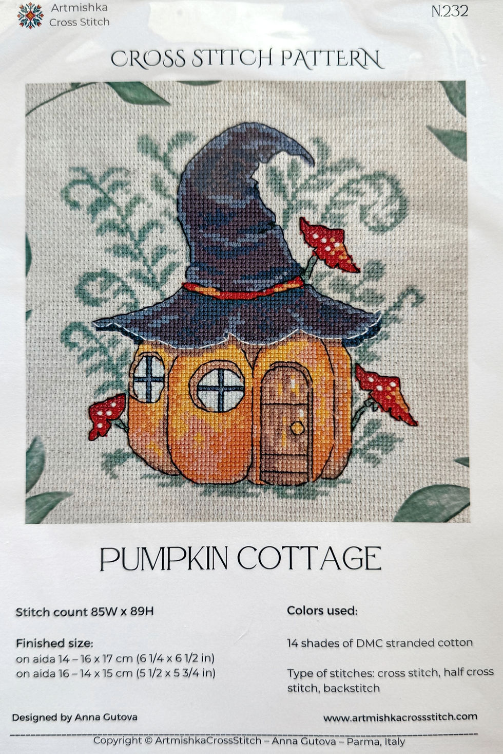 Pumpkin Cottage cross-stitch with a witch hat, house, and mushrooms Bloomfield Craft.