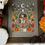 Thumbnail: Fall Bell Jar counted cross stitch pattern with pumpkins and flowers.