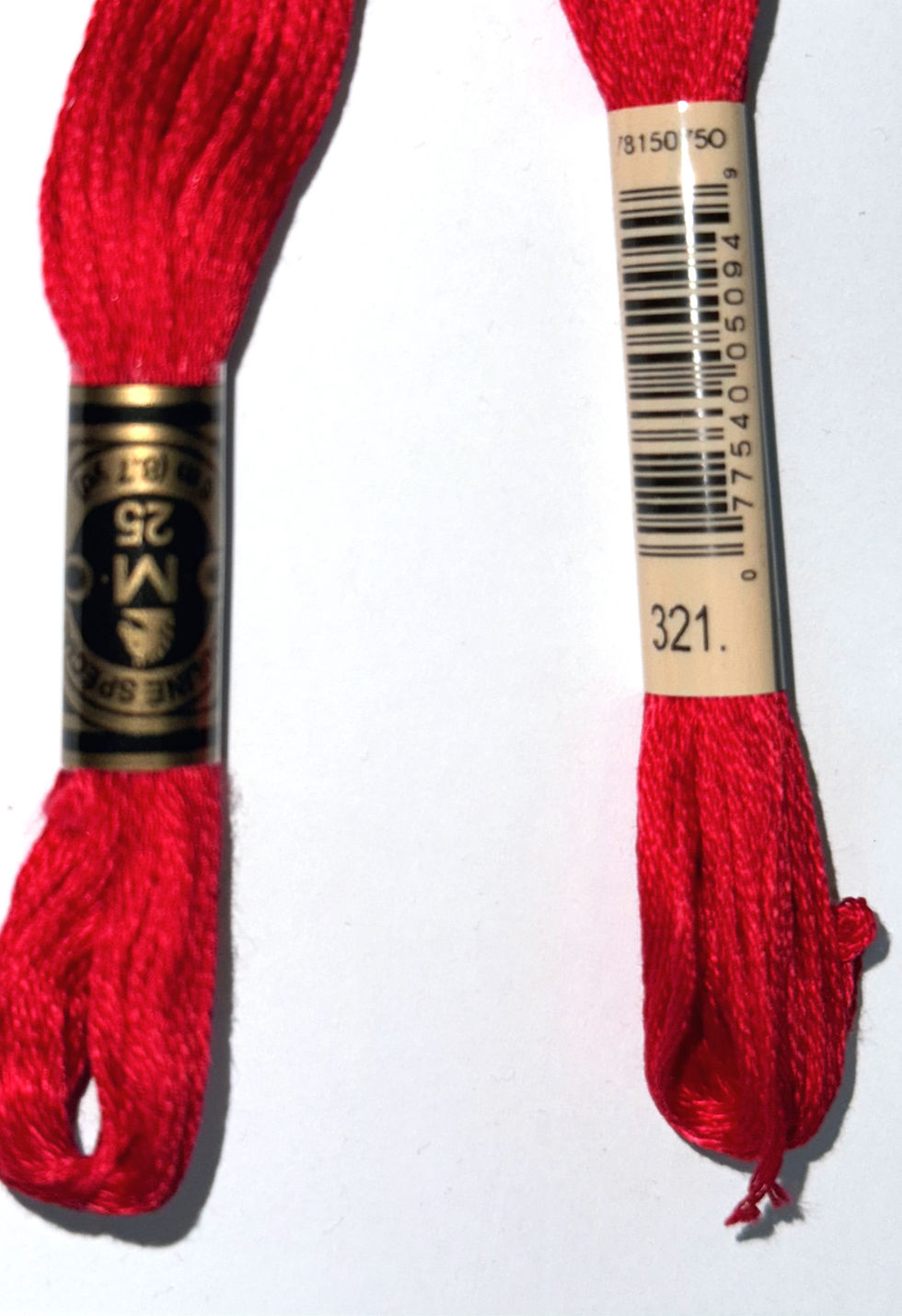 Two red DMC Floss, featuring 321 and other text, on white background.