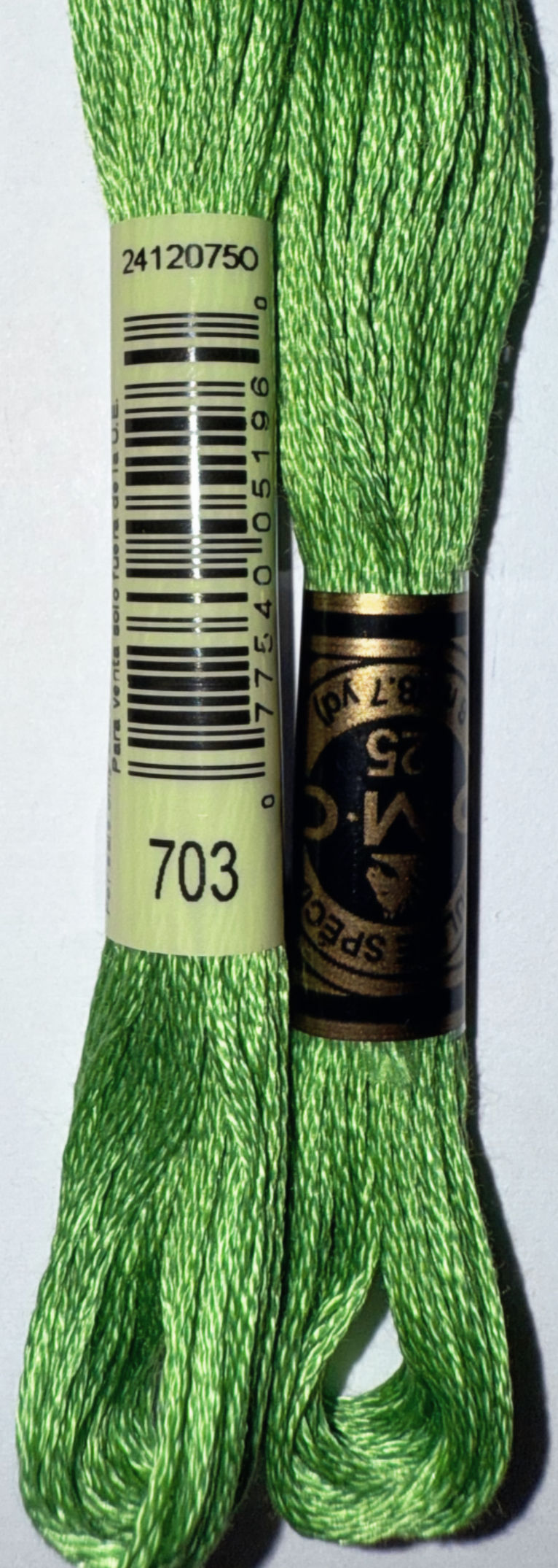 DMC 703 and DMC 25 embroidery floss in green color for crafting projects.