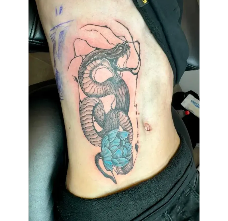 A picture of a snake tattoo