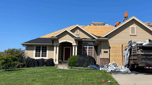 Roof in Omaha being replaced by a Rocket Roofing Crew.