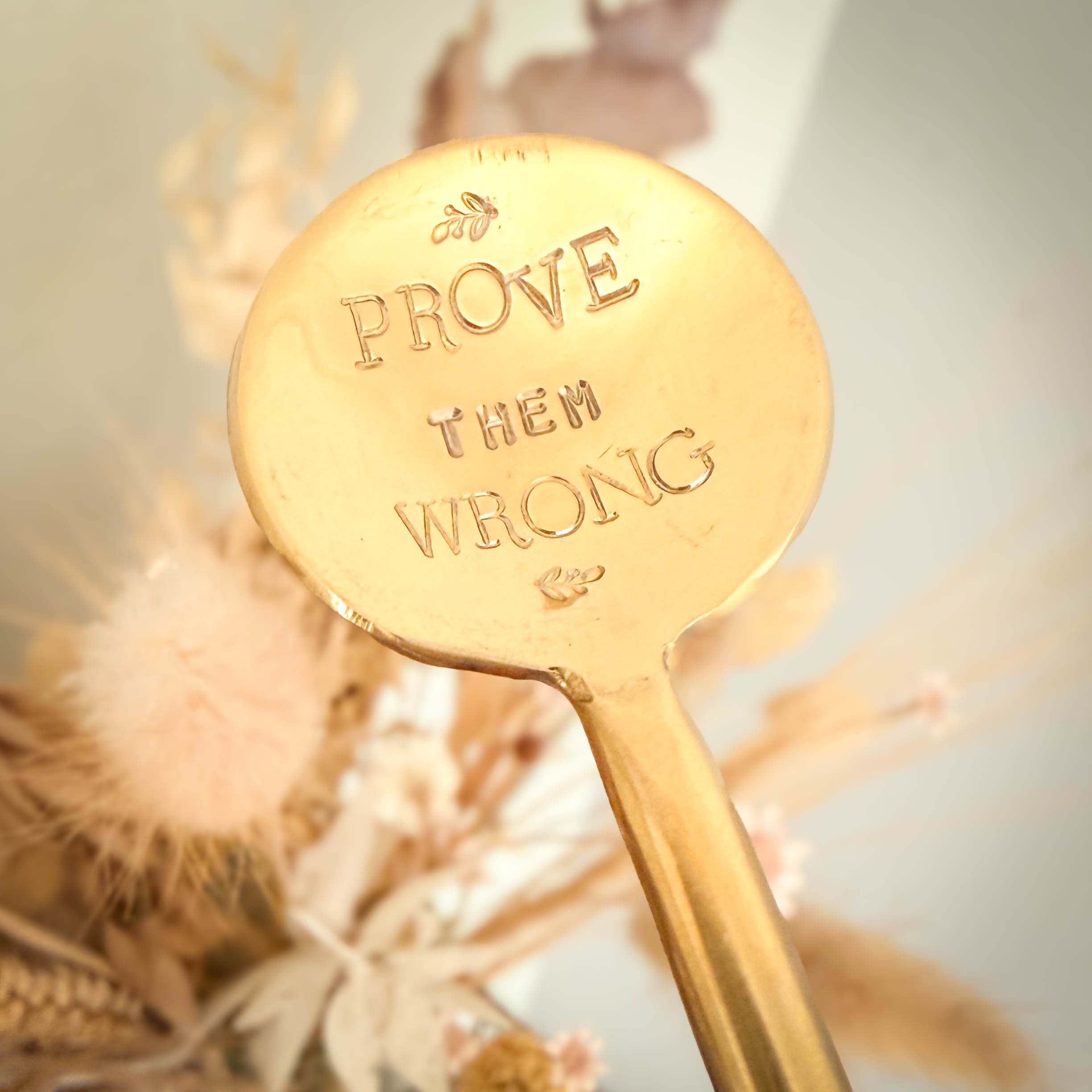 'Prove them wrong' gold coloured small round teaspoon