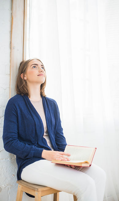 thoughtful-pretty-woman-home-holding-book.jpg