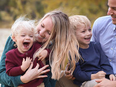 Post author with her two small boys and husband