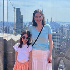 Mom and daughter smile stand on an observation deck in NYC and smile at the camera. Image courtesy of Food Allergy Fund.