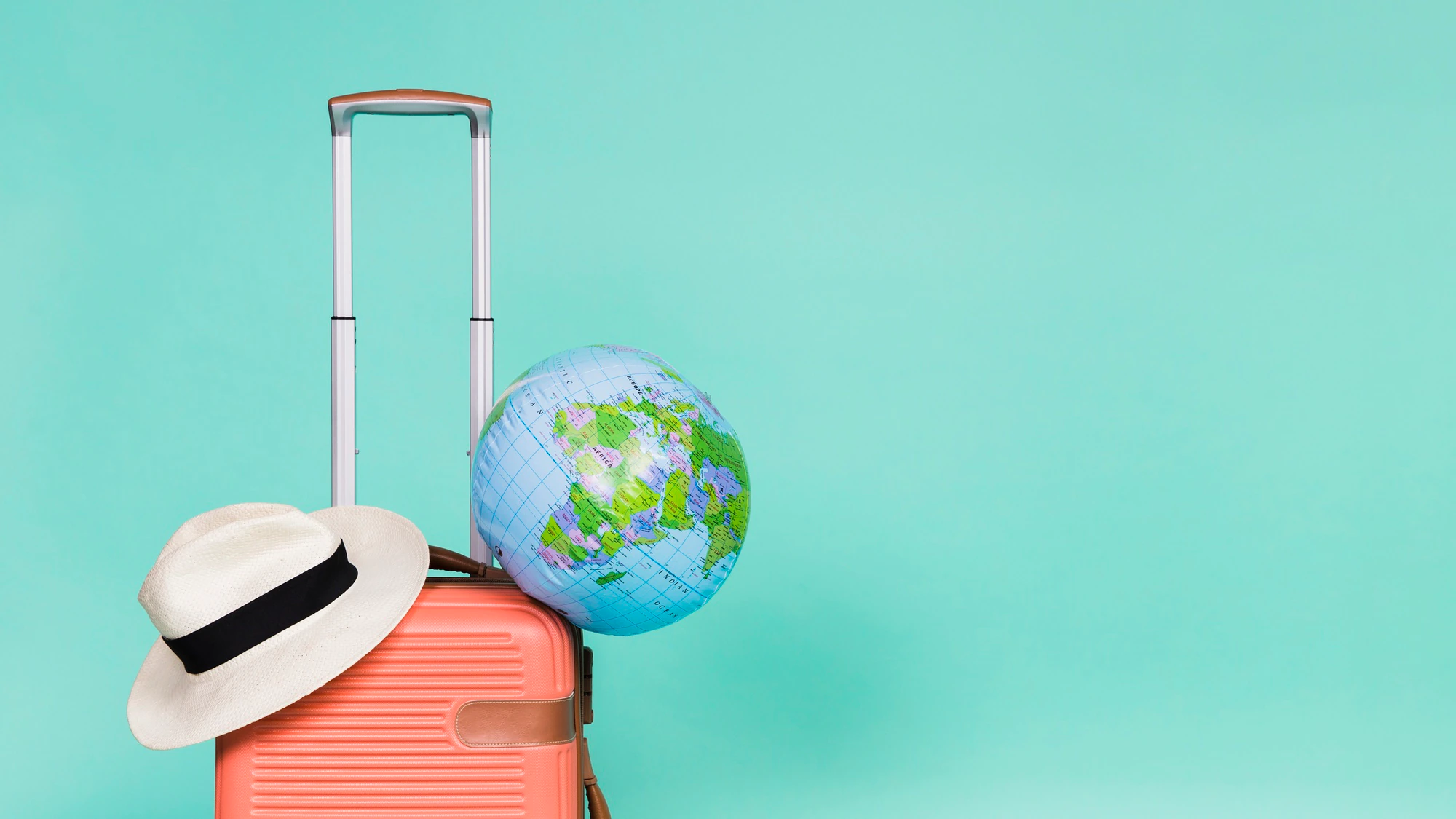 pink-suitcase-with-hat-globe-it_23-2148169893.jpg.webp