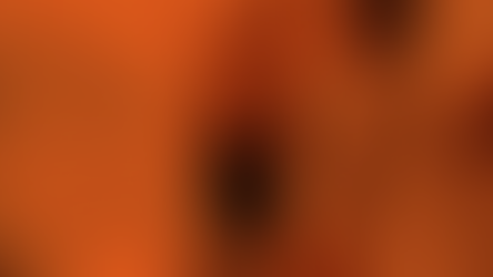 A smiling woman wearing glasses raises her hands for a celebratory high-five with a colleague in a bright office, reflecting enthusiasm and teamwork around driving positive social impact.