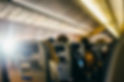 rear-view-people-sitting-airplane.jpg