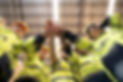 vecteezy_portrait-of-happy-workers-giving-high-five-at-warehouse_31608034.jpg