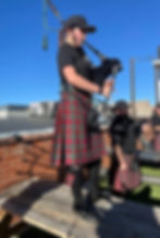 Playing the bagpipes for St. Patrick's Day at an Irish Pub.
