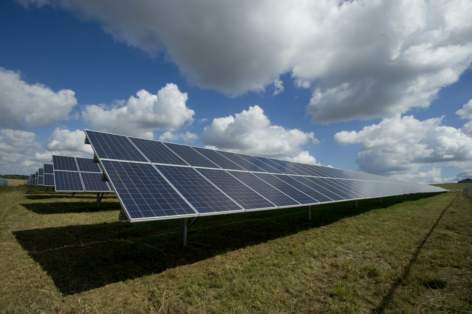 Utility-scale solar farm under a blue sky